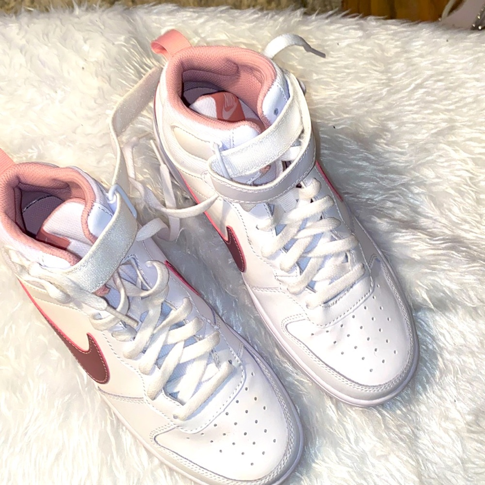 Pink and white high top Nikes